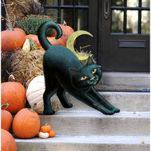 Load image into Gallery viewer, Black cat statue on Halloween-themed steps with pumpkins and a moon decoration.