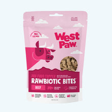 Load image into Gallery viewer, West Paw Rawbiotic Bites dog food topper pouch in Beef flavor, featuring a pink and magenta design with a cow illustration and a clear window showing the raw meat pieces inside.