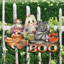 Load image into Gallery viewer, Decorative Halloween sign with a ghost, cat, and fox on a wooden ladder against a green bush background.
