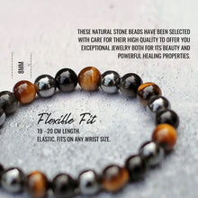 Load image into Gallery viewer, Beaded bracelet with natural stone beads on a textured surface
