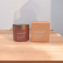 Load image into Gallery viewer, Medicube collagen jelly cream jar and box on a wooden surface with a light background

