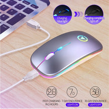 Load image into Gallery viewer, Gaming mouse with RGB lighting on a desk, connected to a computer keyboard.
