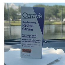Load image into Gallery viewer, CeraVe Skin Renewing Retinol Serum box on a white surface with a blurred outdoor background
