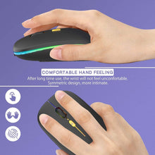 Load image into Gallery viewer, Hand holding a black mouse with green and blue lights on a purple background, emphasizing comfort and design.
